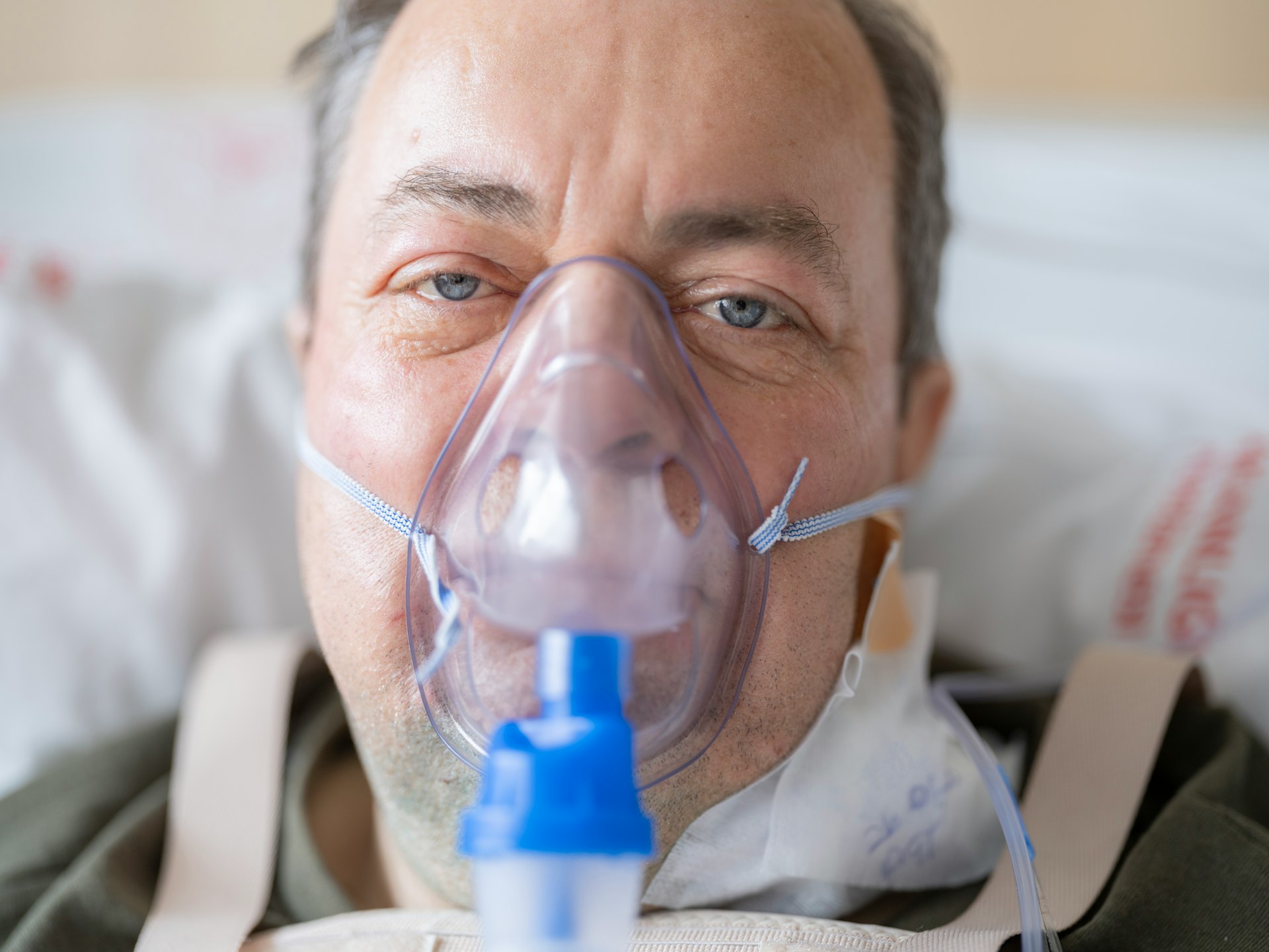 a man with a respirator on his face